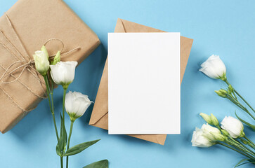 Greeting card mockup with white eustoma flowers, blank card with copy space
