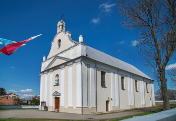 General view and close-up of architectural details of the sacred complex built in 1791, i.e. the belfry and the Catholic church of Saint John the Baptist in the town of Piski in Masovia in Poland.