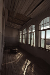 Inside destroyed buildings. Photo from the ghost town of Kolmanskop, nearby Lüderitz, in the Namib desert. Namibia, Africa.