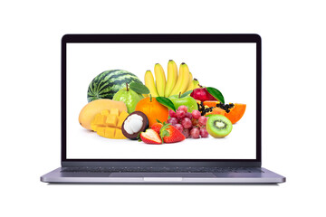Fresh mix fruit on laptop computer screen isolated on white background. (My image)