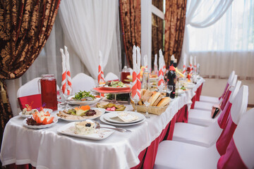 Wedding evening. Elegant and modern restaurant in classic style with wooden walls and big windows. Interior design restaurant