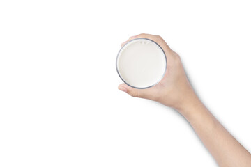 Closeup hand hold glass of milk isolated on white background. Top view. Flat lay.