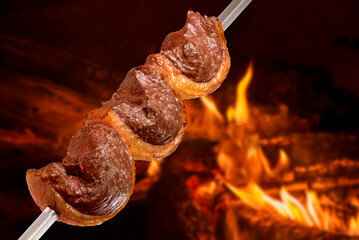 Picanha barbecue roasted on the spit on the coals. This type of barbecue is widely consumed...
