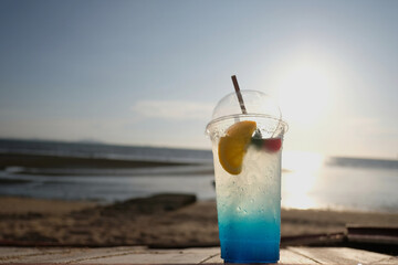 blue lemon soda on summer beach