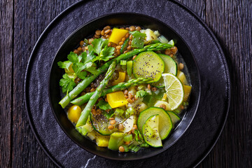 alkaline green soup in black bowl, top view