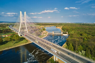 Large modern bridge over river in europe city with car traffic, aerial view. Redzinski bridge over...