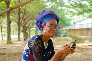 lady smiling she uses her credit to purchase things online