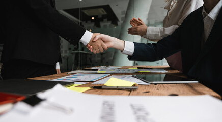 Business people shaking hands, finishing up meeting, business etiquette, congratulation, merger and acquisition concept