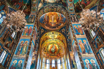 Fototapeta na wymiar The interior of the Church of the Savior on Spilled Blood with colorful mosaic frescoes on biblical subjects. Saint Petersburg, Russia