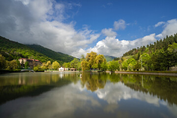 Clouds formation moving above the artificial city lake of Dilijan, Armenia