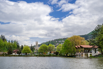Fototapeta na wymiar Clouds formation moving above the artificial city lake of Dilijan, Armenia
