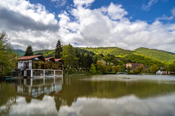 Fototapeta na wymiar Clouds formation moving above the artificial city lake of Dilijan, Armenia