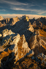 Autumn in the Italian Dolomites. The most beautiful time of the year to visit this place. Beautiful colors and breathtaking views. Mountain peaks above the valleys.