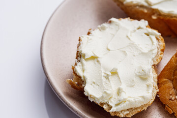 baguette cream cheese sandwich on a white background