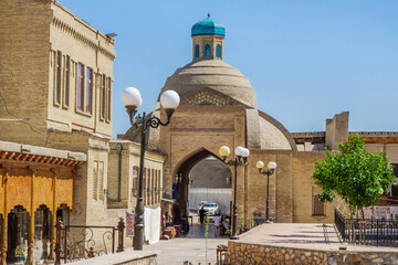 Main building of Toqi Sarrofon, traditional covered bazaar in Bukhara, Uzbekistan. Building was built in classical Central Asian style in 16th century and still used for trade - obrazy, fototapety, plakaty