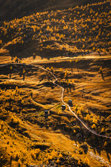 Autumn in the Italian Dolomites. The most beautiful time of the year to visit this place. Beautiful colors and breathtaking views. Mountain peaks above the valleys.