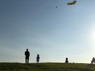 Fototapeta na wymiar Flying a kite