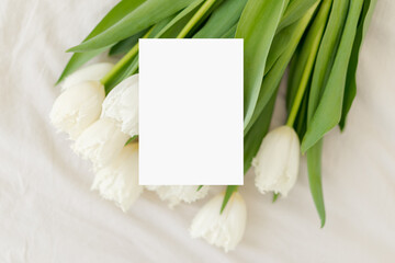 Bouquet of white tulips with card. Vertical menu card mock up, name card, place card, wedding invitation mock up