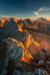 Fototapeta na wymiar Autumn in the Italian Dolomites. The most beautiful time of the year to visit this place. Beautiful colors and breathtaking views. Mountain peaks above the valleys.