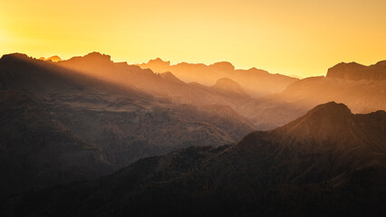 Autumn in the Italian Dolomites. The most beautiful time of the year to visit this place. Beautiful colors and breathtaking views. Mountain peaks above the valleys.
