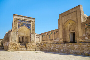 Fototapeta na wymiar Panorama of medieval Muslim mausoleums in the Chor Bakr memorial complex, Bukhara, Uzbekistan. Left one is Oyposhshooyim vault (17th century)