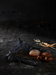 Coffee and chocolate cookies on black background 