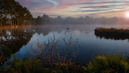 Fototapeta premium Sunrise over the river with foggy at Wang Kwang Reservoir Phu Kradueng National Park, Loei, Thailan
