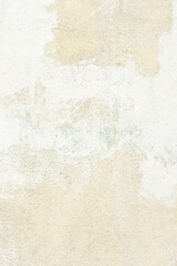 White plaster wall texture background. Pattern of white plaster wall in rough aged structure. Vertical orientation