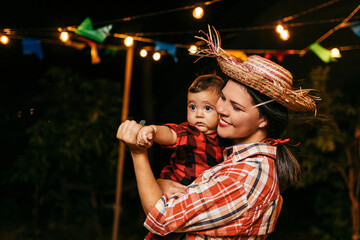 Portrait of mother and baby son during the typical Brazilian Festa Junina