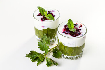 Delicious dessert with a layer of yogurt, nettle smoothie and honeysuckle jam. Dessert is served in...