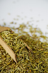 fragrant dried rosemary on a white acrylic background