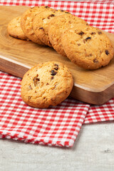 Focus on delicious cookies on cutting board.
