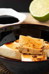 Japanese tofu with soy sauce. Selective focus.