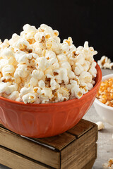 Delicious salty popcorn in a bowl. Selective focus.