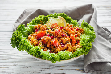 traditional turkish salad kisir on white rustic background