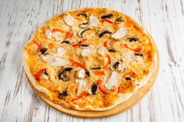 delicious hot traditional italian pizza on a white wooden rustic background