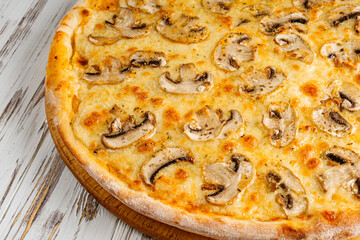 delicious hot traditional italian pizza on a white wooden rustic background