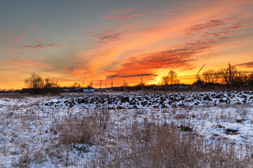 View of a beautiful sunset from a snowy field