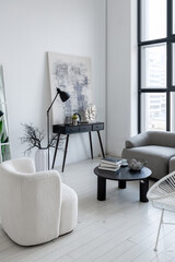 Fototapeta premium modern minimalistic interior design of light bright monochrome room with black and white furniture, clean white walls and huge windows