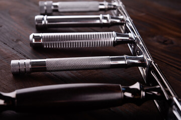 Set of razors on wooden background