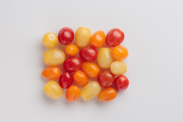 Fototapeta na wymiar Yellow, orange and red cherry tomatoes