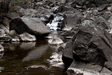 Obraz premium Rocky creek with a small waterfall in the Montenegro coastal region