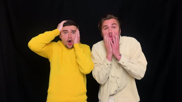 Two guys have shoked reaction after what the've seen, upset and disappointed