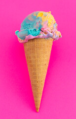 A Scoop of Unicorn Colored Ice Cream in a Cone