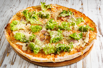 delicious hot traditional italian pizza on a white wooden rustic background