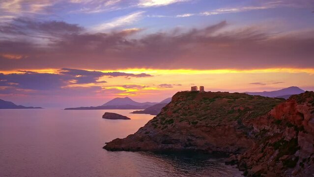 Ancient Greek temple of Poseidon at sunset on cape Sounion Athens Greece