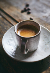 Cup of espresso coffee on rustic wooden background. Copy space