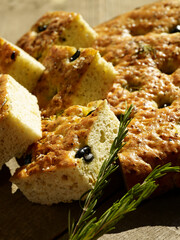 Focaccia slices with herbs and olives