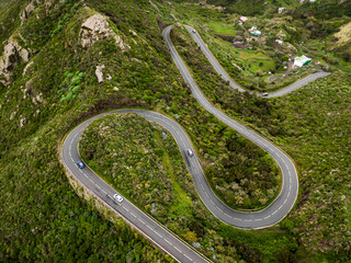 Winding mountain road on the green part of Tenerife island, Spain. Top aerial view. © 9parusnikov
