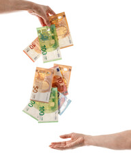 Euro money banknotes falling flying from female hand isolated on white background. 